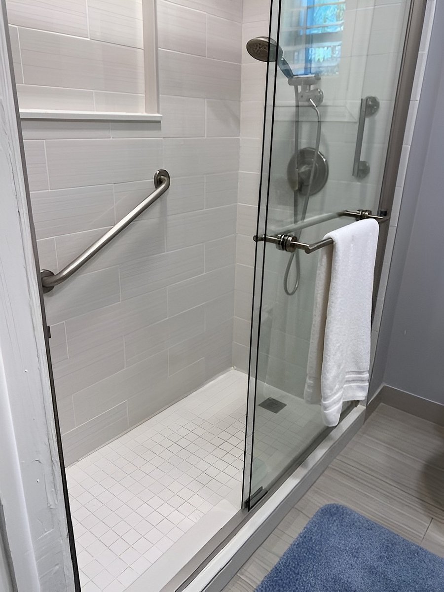 Bathroom: Step in showers w/ support bars, set of towels and hand cloths provided.