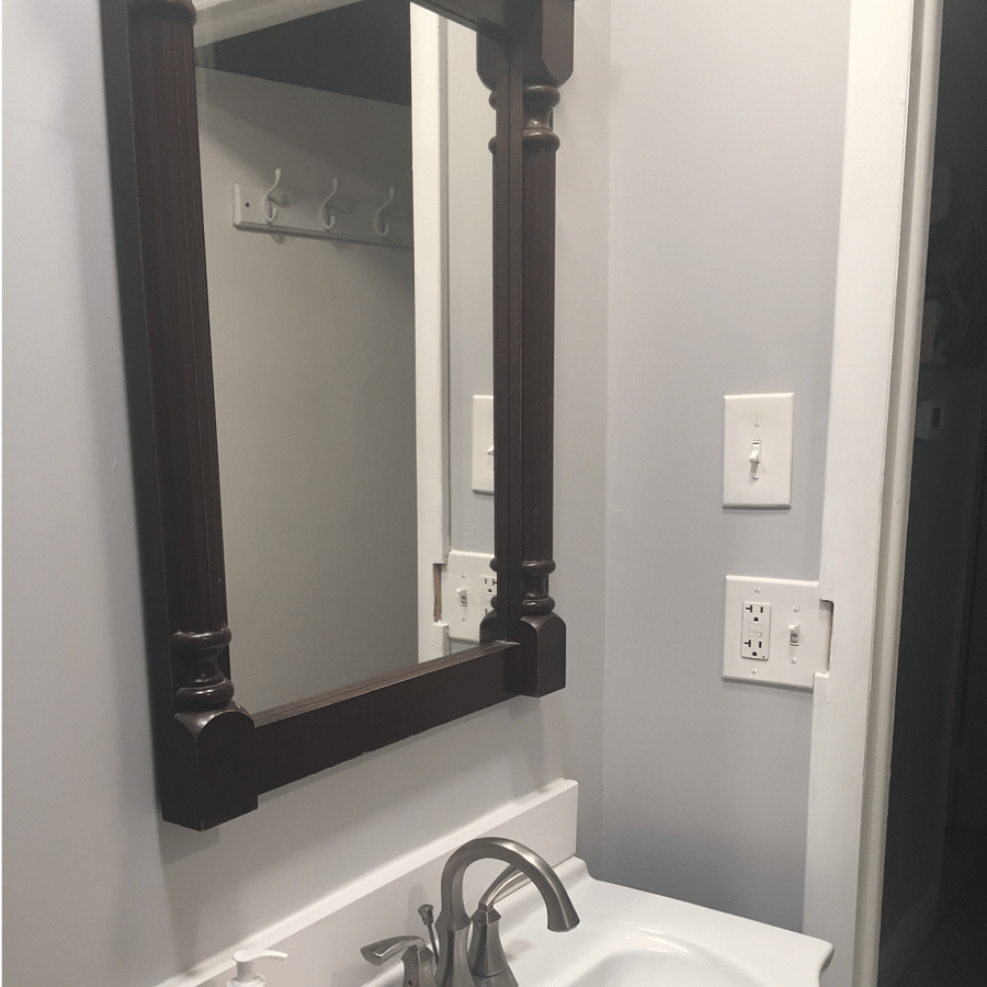 Bathroom: Mirrow and hand sink, starter set of toiletries provided.