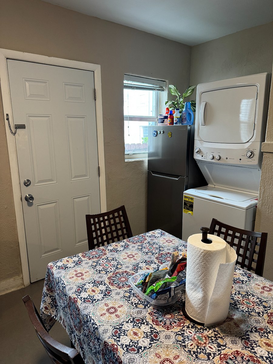 Kitchen:  Refrigerator, washer-dryer, kitchen table. Starter set of detergent, clorox and softener provided.