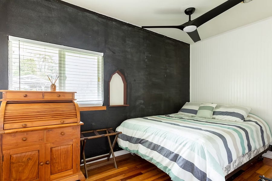 small bedroom with queen bed