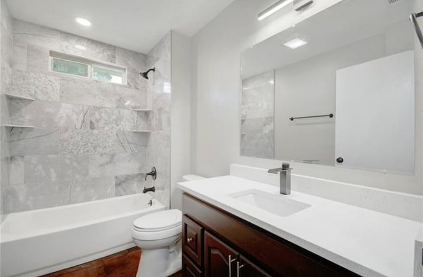 Main Bath with Tub/Shower and Marble Tile