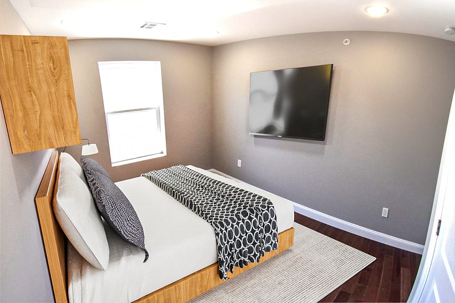 Bedroom #4 with queen size bed, 4K smart TV, closet organizer, night stand and wall bookshelf.