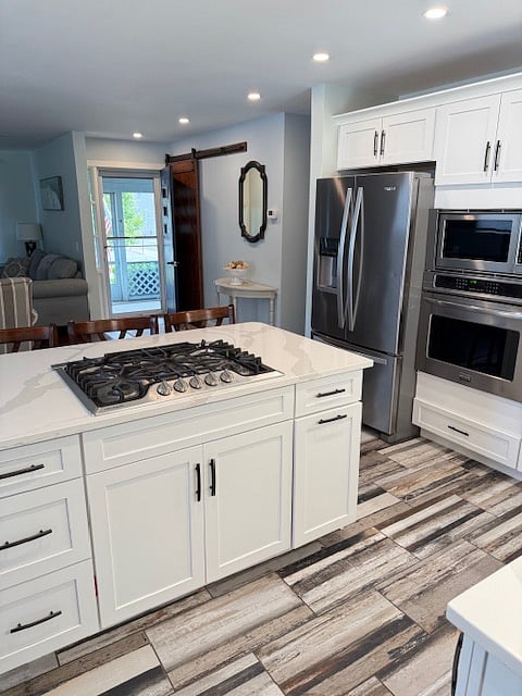 breakfast bar and gas range for cooking