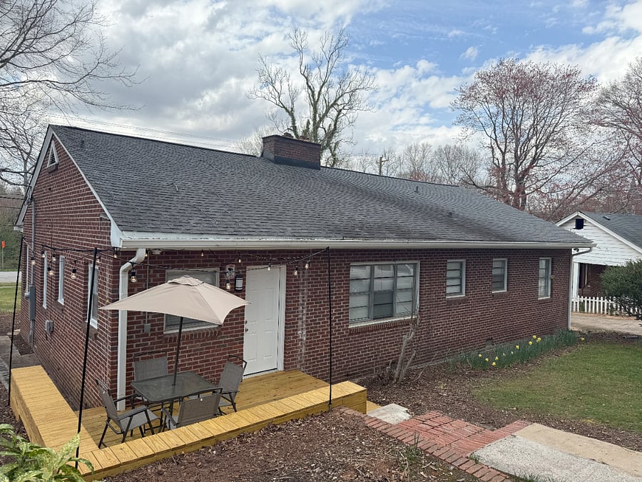 Back of House with Back Deck with Table and Chairs