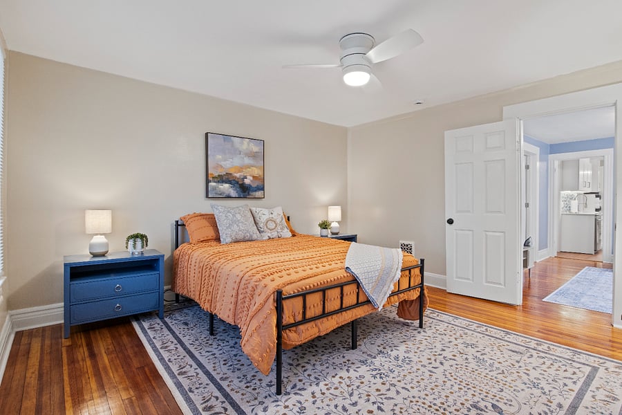 Master bedroom featuring decor and nightstands.