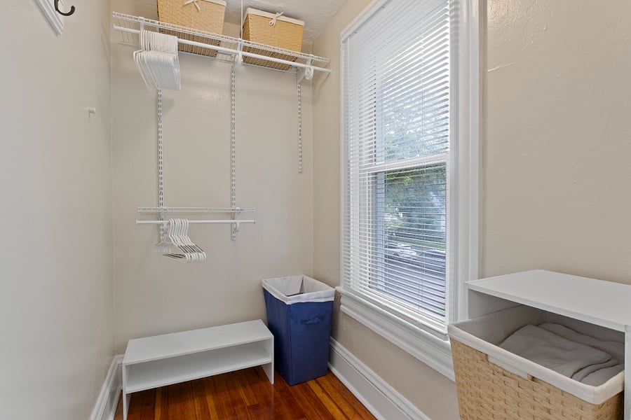 Master bedroom walk-in closet featuring closet organizers.