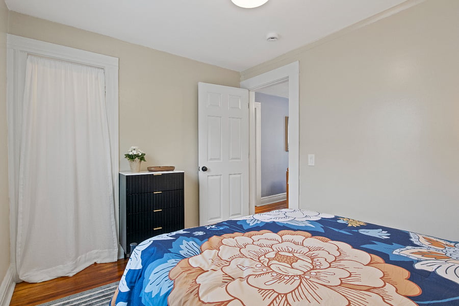 Full bedroom looking into living room