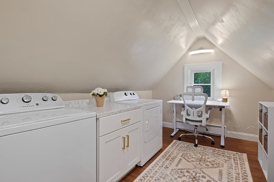 Full laundry room featuring standing desk