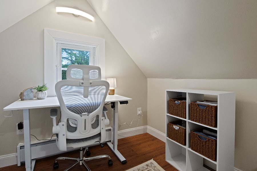Standing desk with ergonomic chair. 
