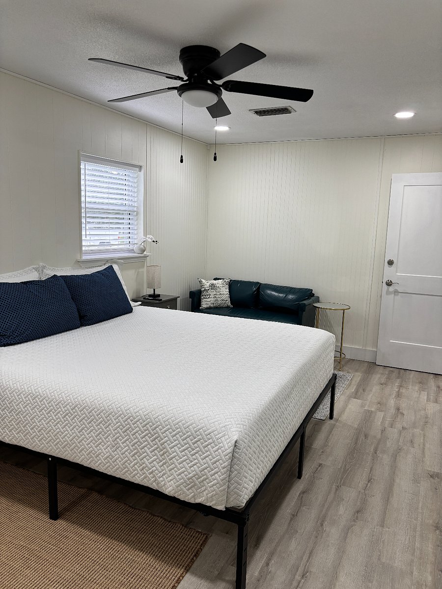 3rd bedroom w King bed and small loveseat. Nightstands w lamps and power/charging cord access provided