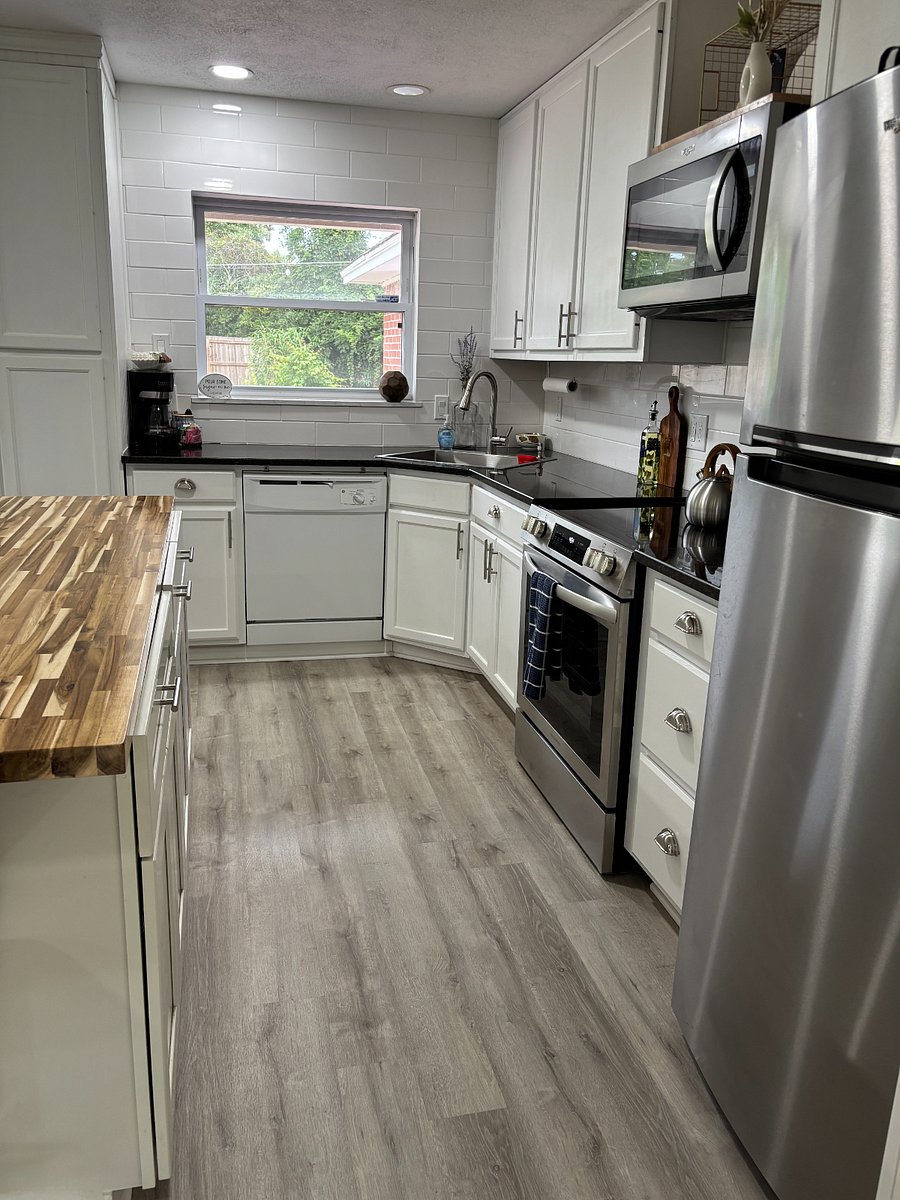 Full backsplash and custom counters plus oversized single basin stainless sink