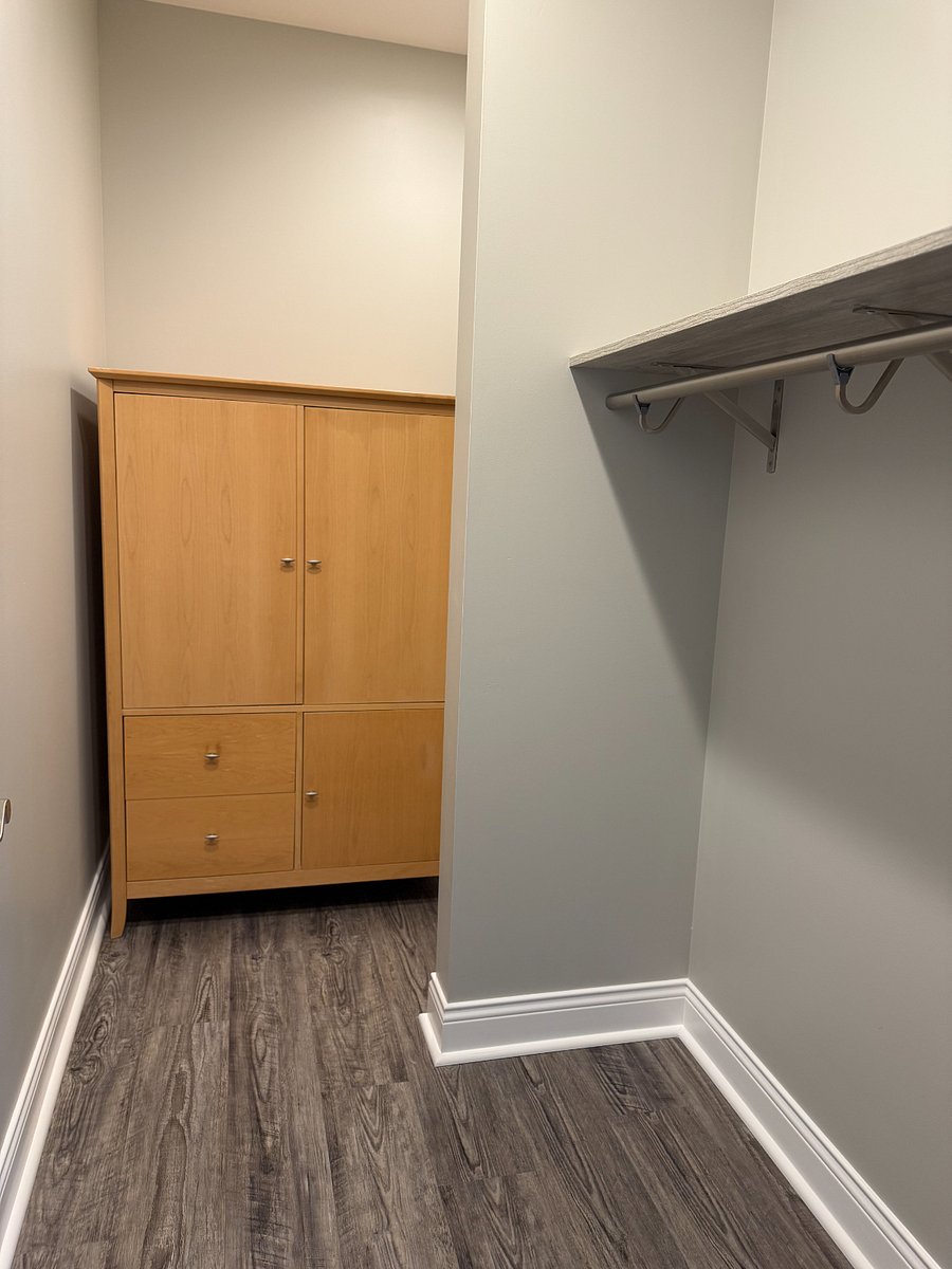 Storage cabinet in large walk-in closet.