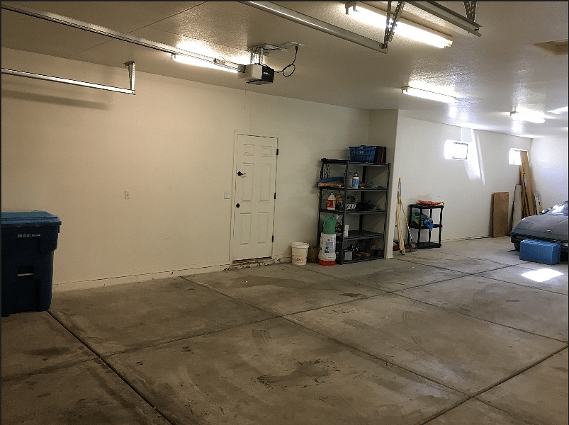3 car garage minus one spot for stored Corvette