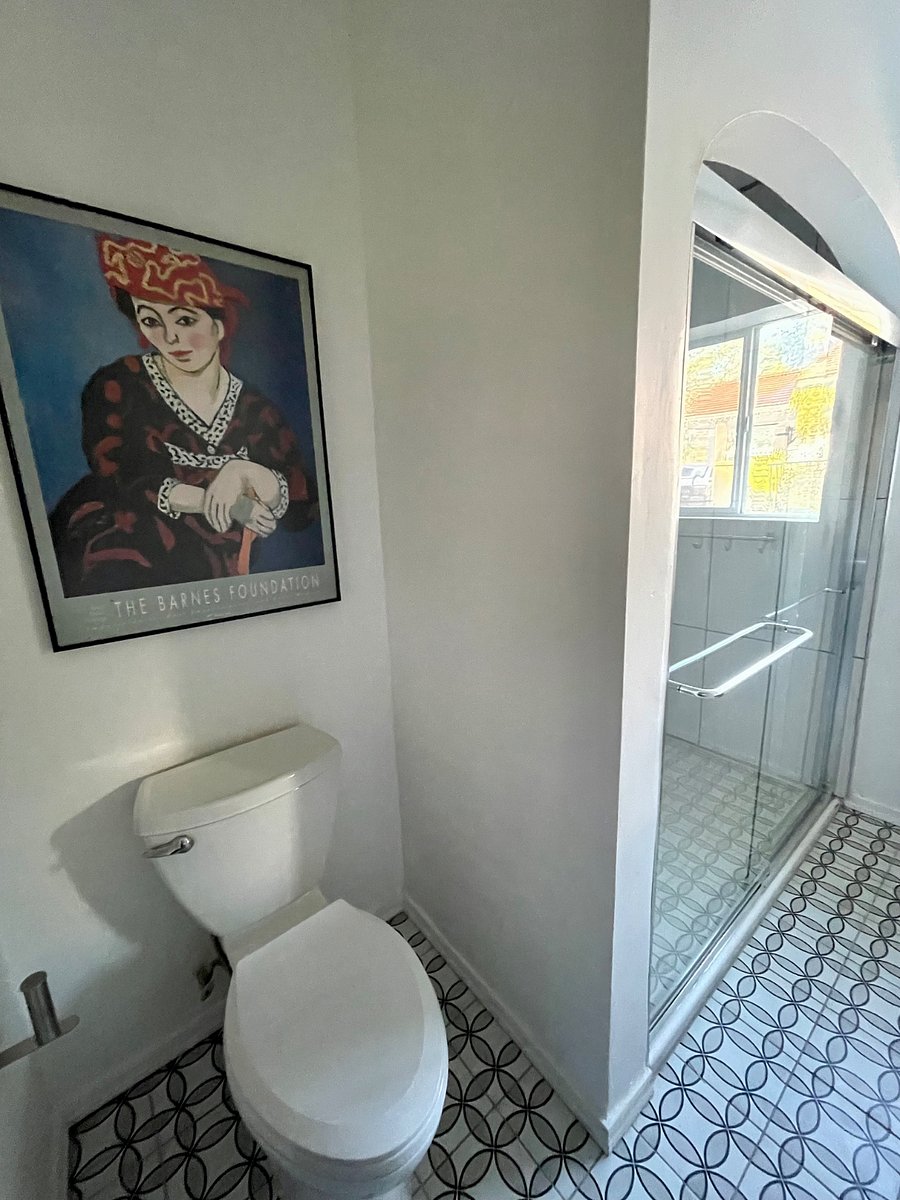 Second full bathroom with large shower and beautiful lighting 