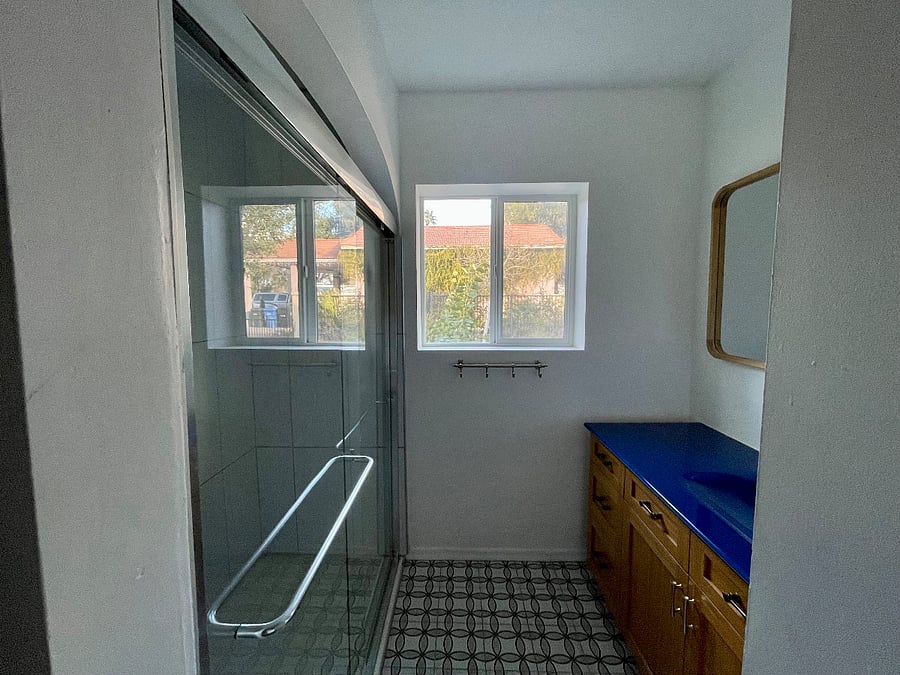 Second full bathroom off of hallway between the second and third bedroom