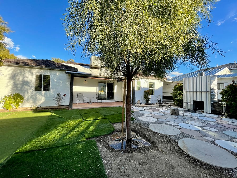 View of the fully gated backyard. There is a fire pit for cozy evenings under the stars, And plenty of sun or shade to enjoy. Perfect for pets and people - especially after a long day. Very quiet and private. 
