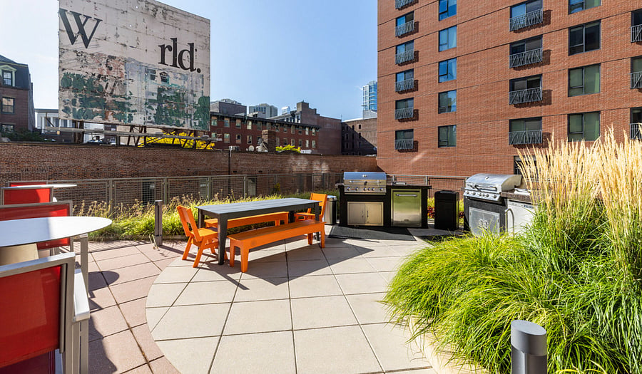 OUTDOOR GARDEN & BBQ AREA
-- (EXTERIOR AMENITY / COMMON SPACE)
-- open to all residents in the building.