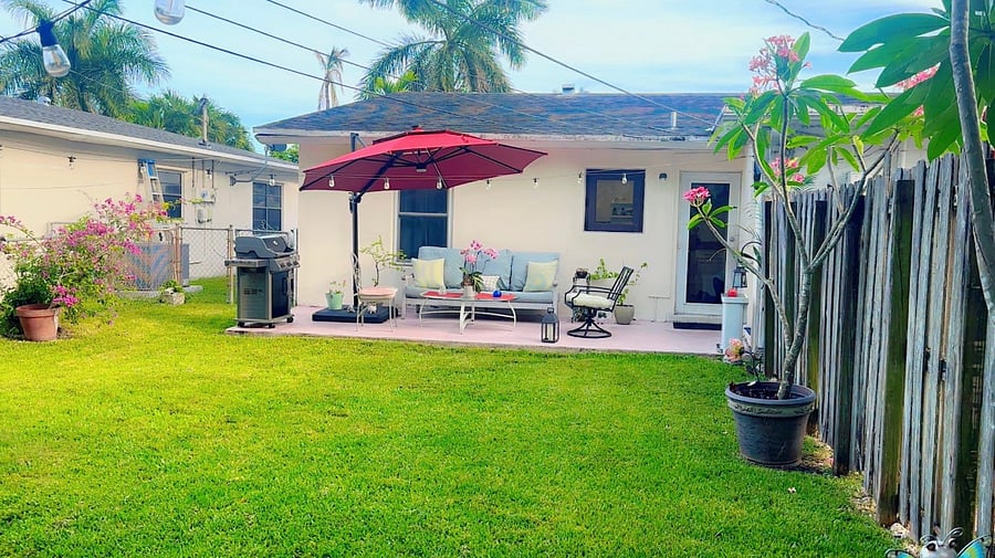 The backyard also includes a cornhole game, a BBQ grill, and plenty of open lawn for pets or play. Whether youre lounging with coffee or lighting up the evening with friends, this space is made to enjoy day or night.