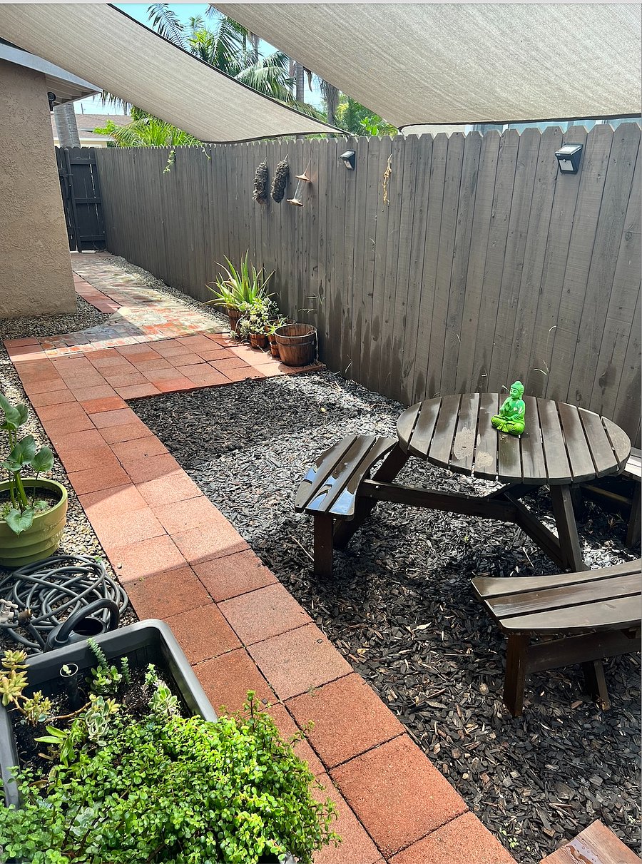 Fully enclosed private side yard that leads to your private entrance. Great for outdoor living, working out, meditating, reading and relaxing. 