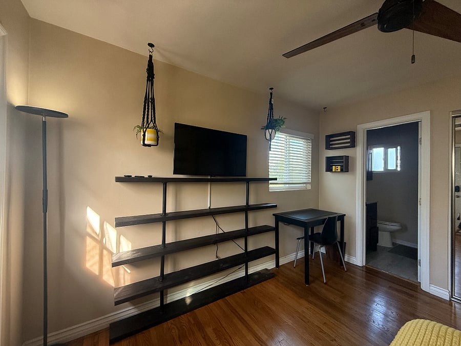 Desk. Bookshelf. Smart TV. 