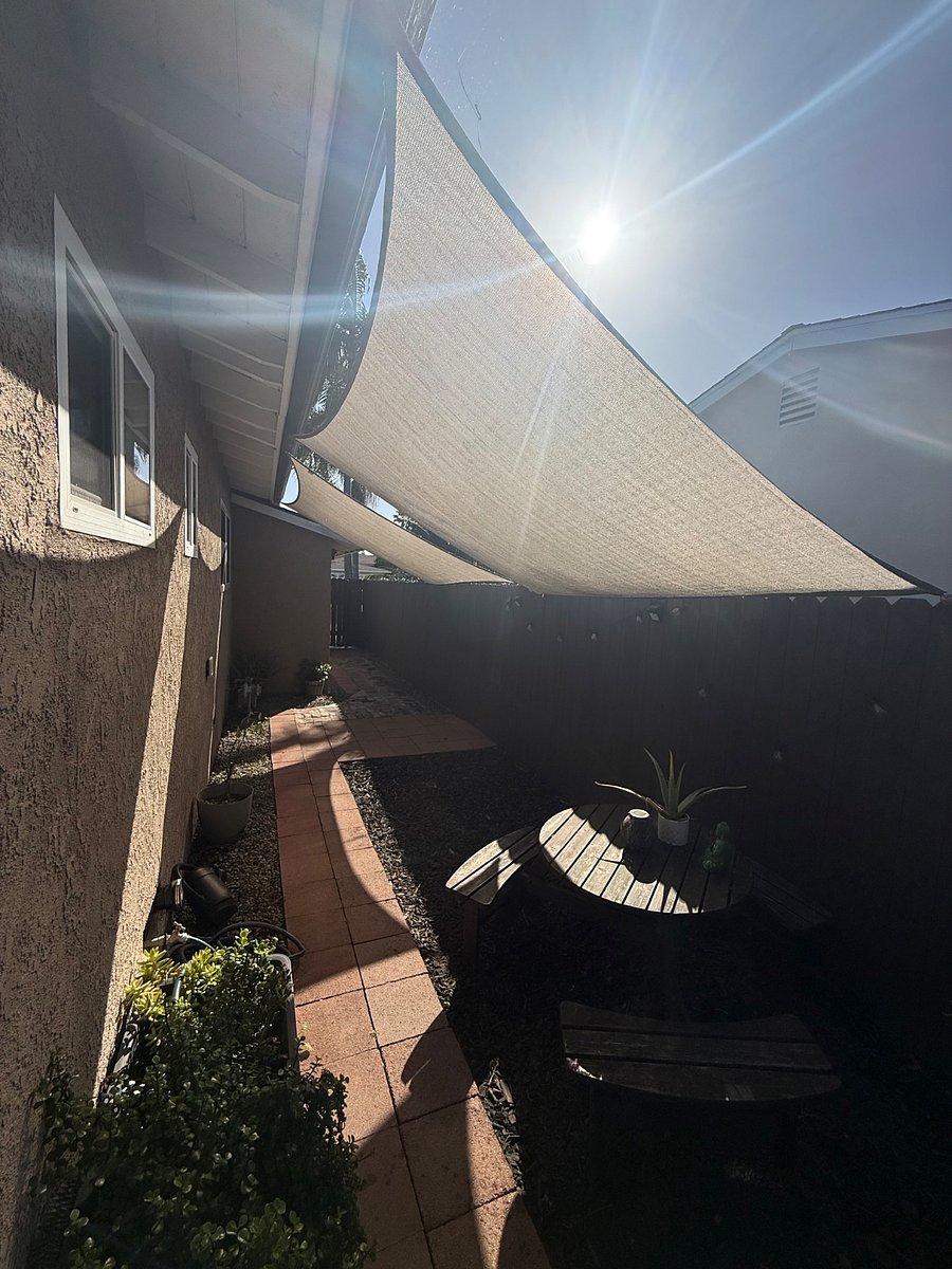 Shaded, private yard and walkway entrance. 