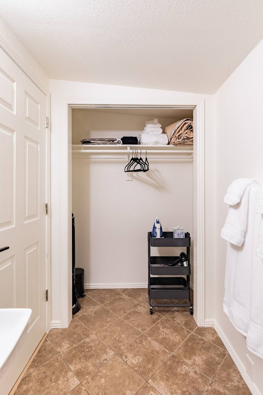 Bathroom has large storage closet with extra amenities
