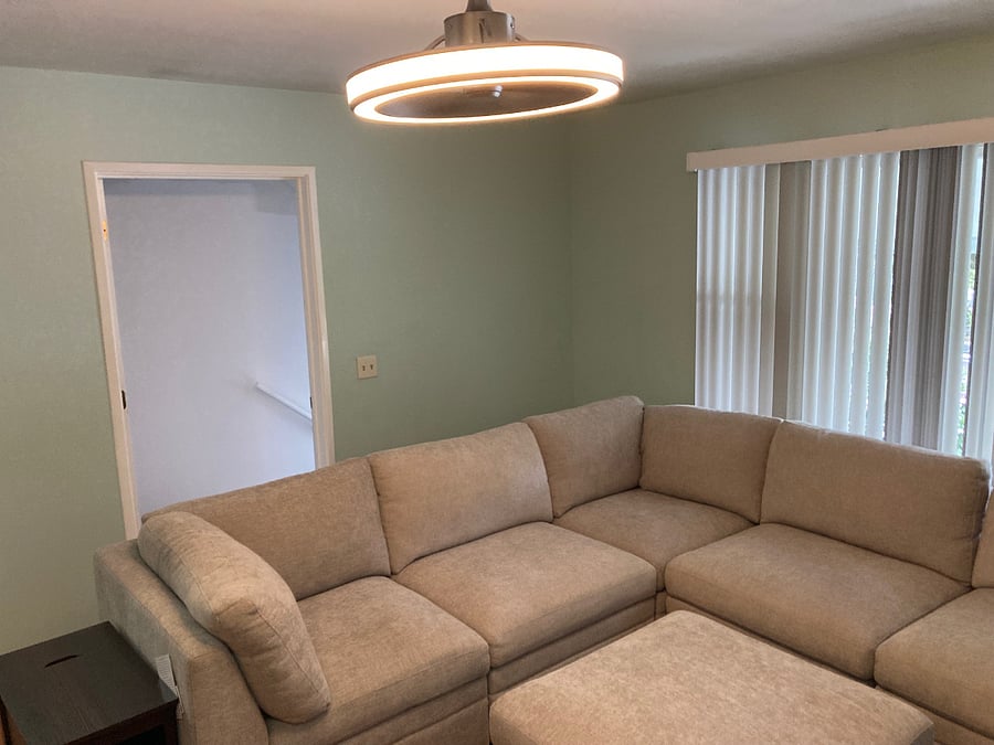 Living room W/ 6 piece sectional & ceiling fan