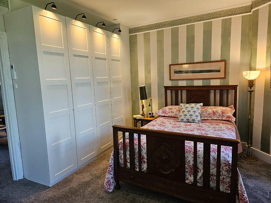 3rd floor guest bedroom with tons of extra closet space, highly unusual for this period (closets were added)