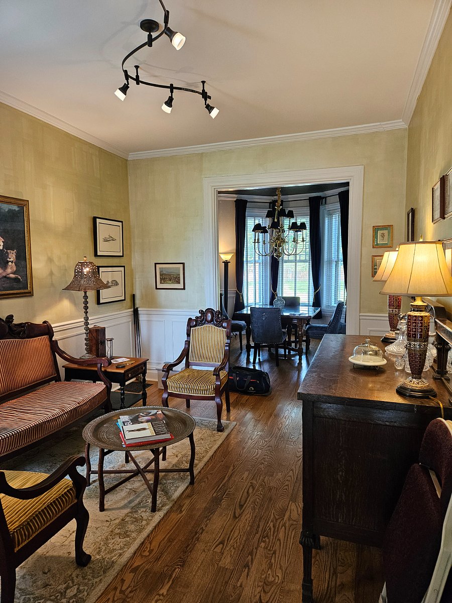 View of parlor from kitchen facing the front of the property on the main level.  Dining is an exceptional spot for work associates or an intimate group of friends.  VERY beautiful.