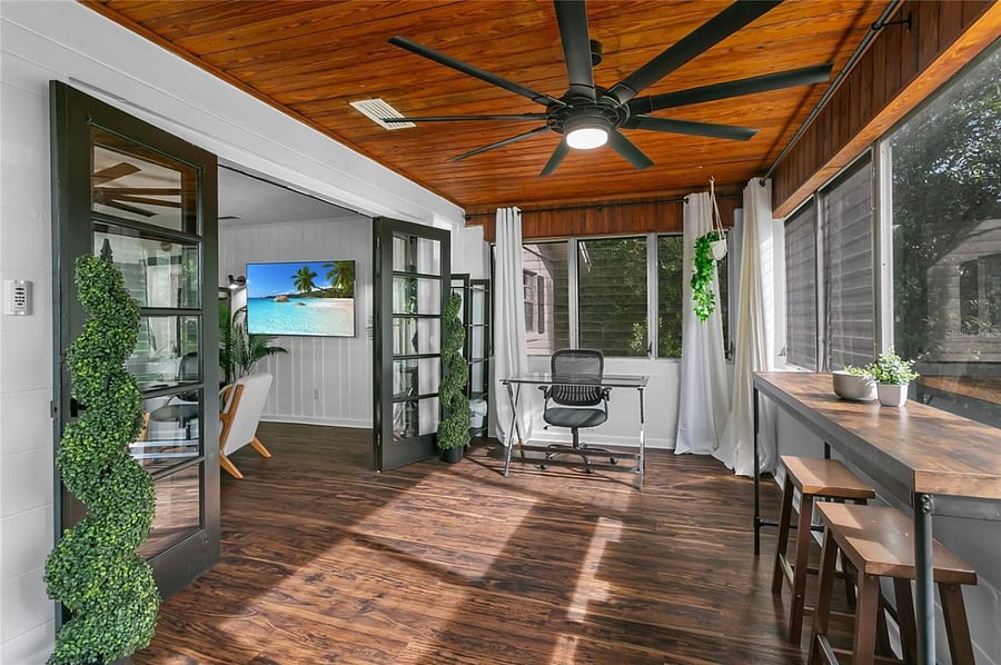 Enclosed patio (off of the living room, not under A/C or heat).  Aka Florida Room.E