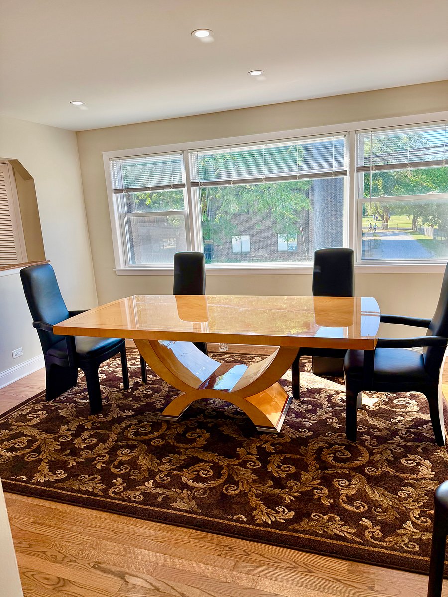 Art Deco solid walnut high gloss dining table with rectangular top on a gondola pedestal.