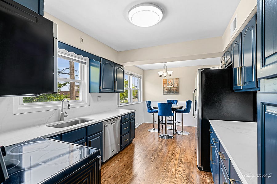 Fully equipped kitchen with stainless steel appliances and ample storage