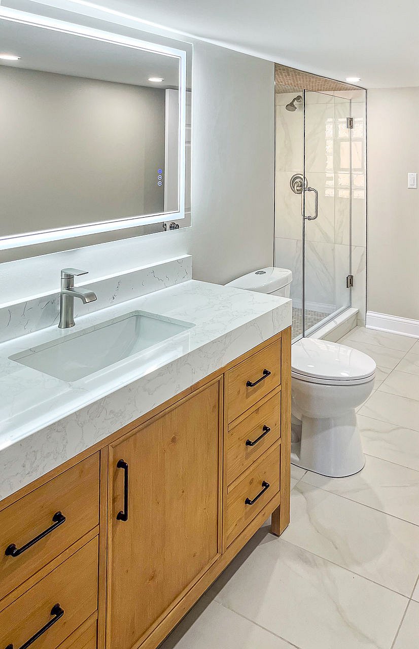 Extra thick marble sink top and solid wood substantial vanity.