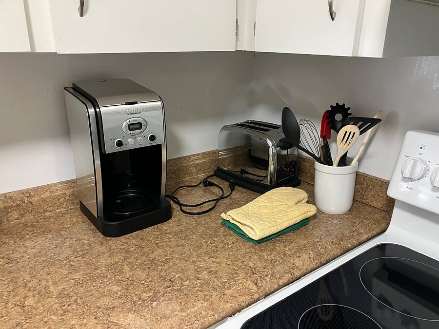  Toaster, coffee maker and cookware are provided