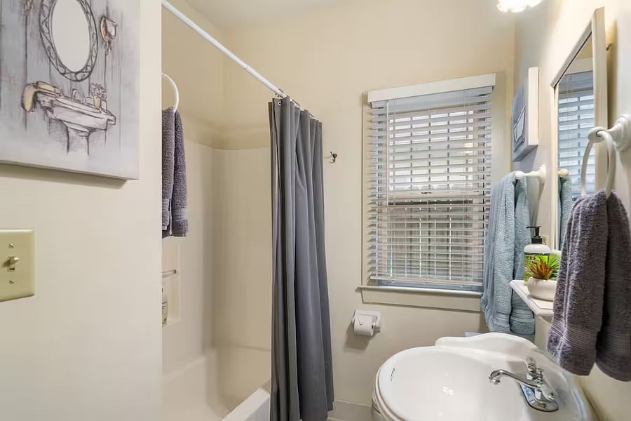 Bathroom 2 features a bath/shower combo and new waterfall shower head.
