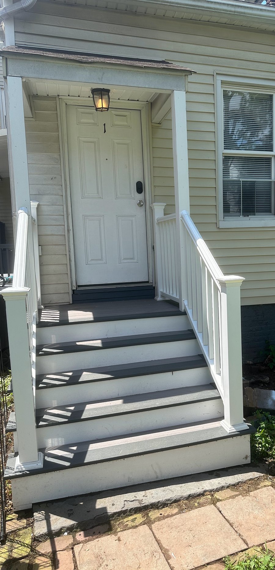 Private entrance in the rear with security camera, floodlights and keycode lock