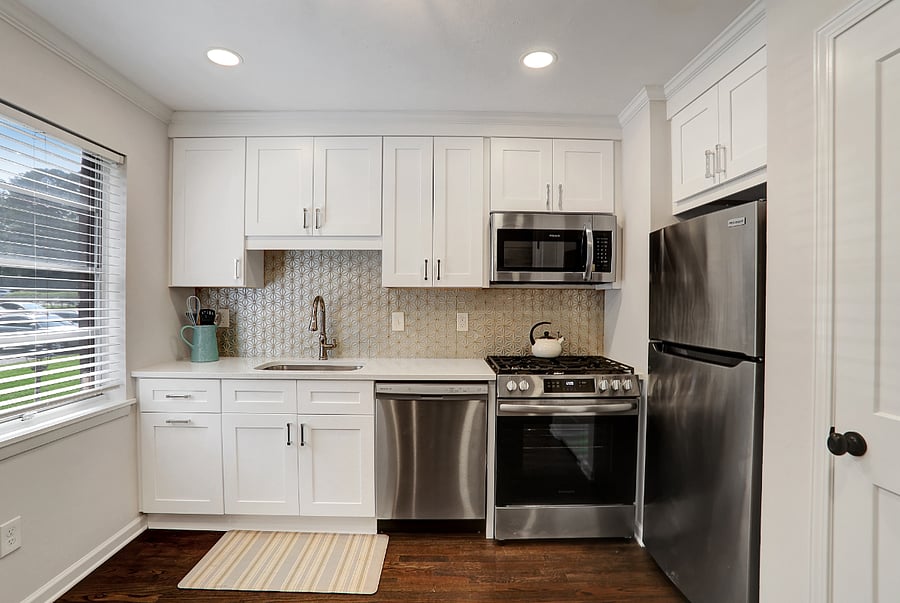Brand new kitchen with large pantry closet, stainless steel appliances including gas range. Furnished with all you need including a ninja air fryer.
