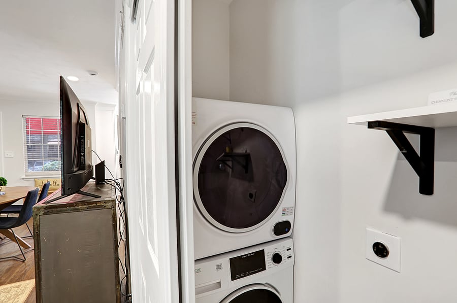 Brand new compact washer and dryer in this closet and still room for storage.