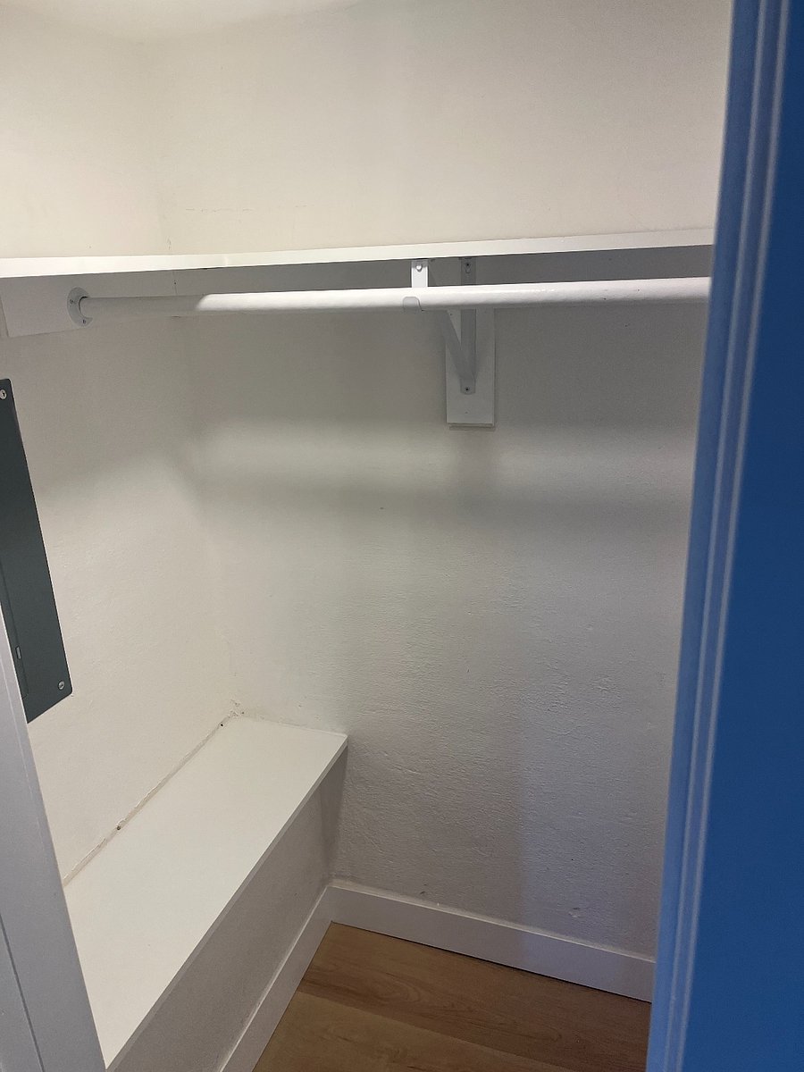 Closet with extra shelf space for storage.
