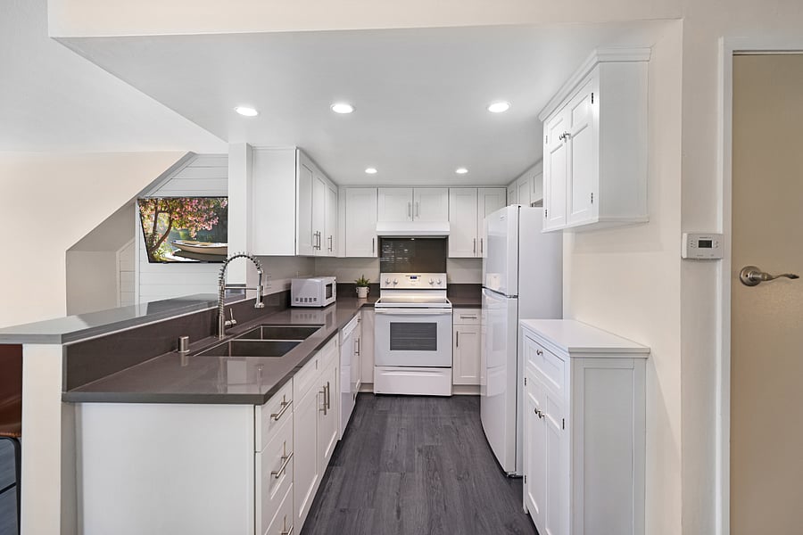 Newly upgraded kitchen with a brand new refrigerator, dishwasher, coffee maker and more