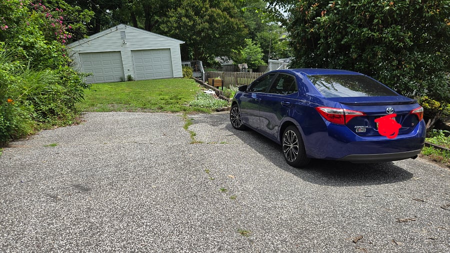 driveway with plenty of space for parking, garage has storage space available