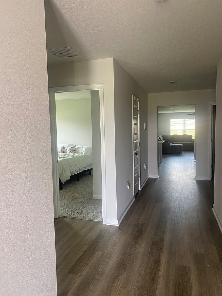 Hallway toward living area with kitchen/dining/living rooms