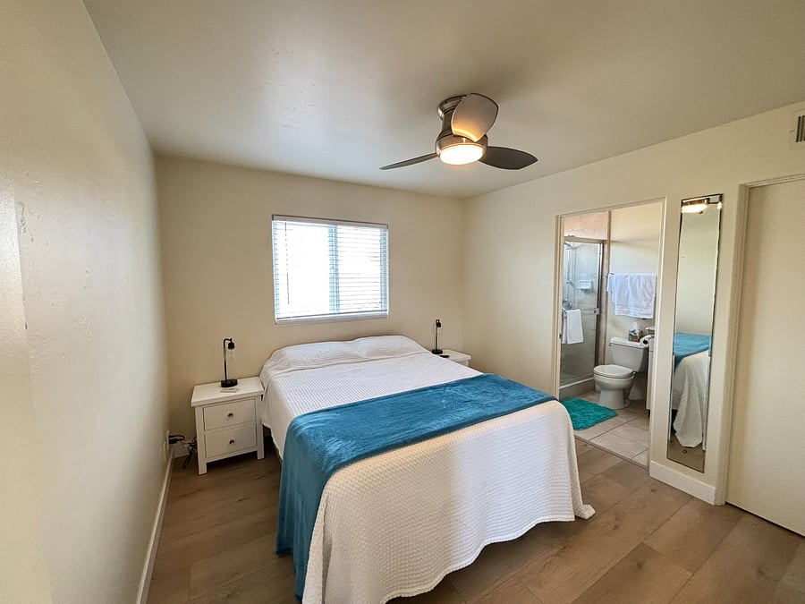 2nd bedroom suite. Queen sized bed with a private bathroom.