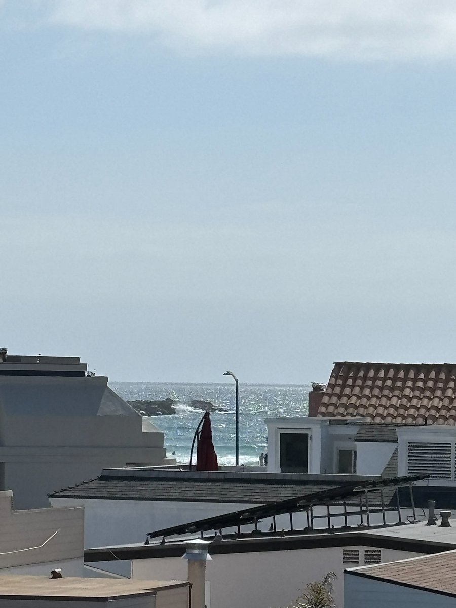 Watch the waves crash over the jetty