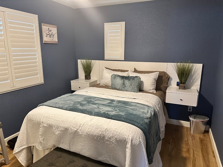 Relaxing Bedroom with Darkening Shutters, remote control lighting and fan. 32 Inch TV
