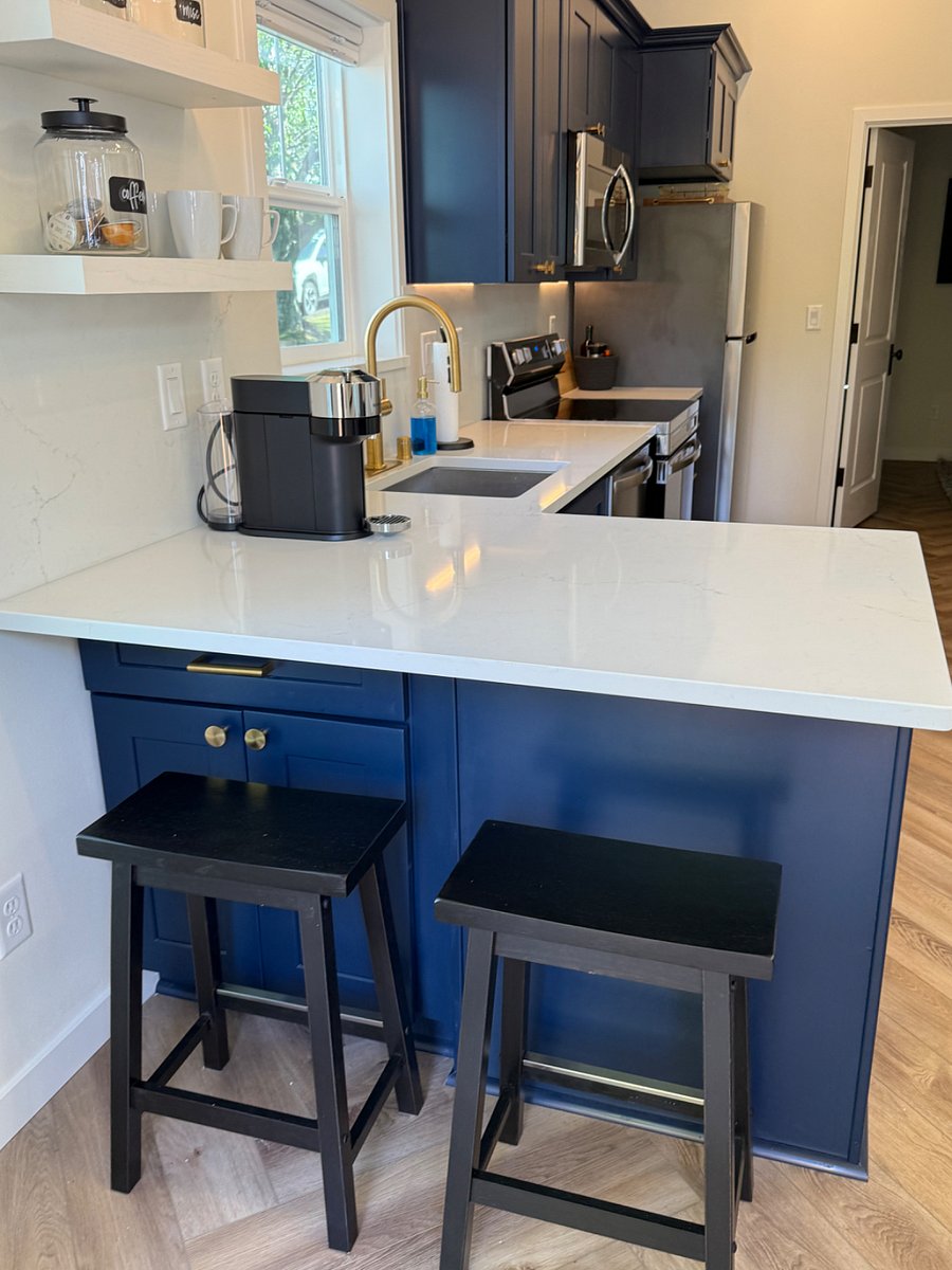 Full sized galley kitchen with plenty of storage and fully equipped