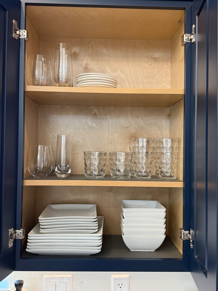 Plenty of glassware with extra in cabinet above