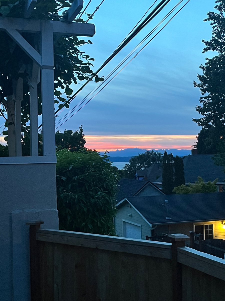 A beautiful sunset showcasing the Olympic mountains from your patio