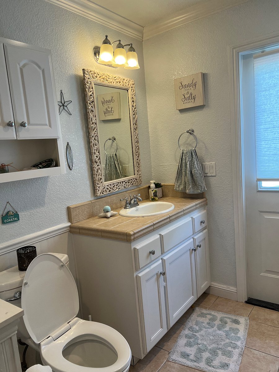 Bathroom sink, this is a nice big bathroom. A shower with tub will be installed in July 2025. The door has access to backyard. 