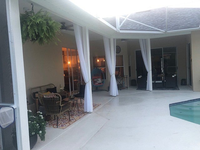 Pool and outdoor sitting area just outside the exterior entry to the guest suite. 